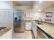 Kitchen with stainless steel appliances and granite countertops at 452 Bouchelle Dr # 303, New Smyrna Beach, FL 32169
