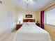 Charming bedroom with a queen-size bed and a window with blinds at 452 Bouchelle Dr # 303, New Smyrna Beach, FL 32169