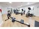 Well-equipped gym with treadmills, elliptical, and rowing machine at 452 Bouchelle Dr # 303, New Smyrna Beach, FL 32169