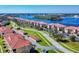 Aerial view of waterfront community and landscaping at 452 Bouchelle Dr # 303, New Smyrna Beach, FL 32169