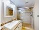 Bathroom with walk-in shower and granite countertop at 452 Bouchelle Dr # 303, New Smyrna Beach, FL 32169