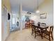 Open concept dining area with kitchen and entryway views at 452 Bouchelle Dr # 303, New Smyrna Beach, FL 32169