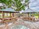 Relaxing community area with picnic tables and covered seating at 452 Bouchelle Dr # 303, New Smyrna Beach, FL 32169