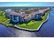 Aerial view of the community, showing waterfront access and lush landscaping at 452 Bouchelle Dr # 303, New Smyrna Beach, FL 32169