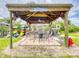 Outdoor covered patio with seating, games and kayaks at 452 Bouchelle Dr # 303, New Smyrna Beach, FL 32169