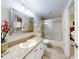 Clean bathroom with granite countertop and a glass shower at 452 Bouchelle Dr # 303, New Smyrna Beach, FL 32169