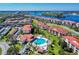 Aerial view of community with pool, water access, and parking at 452 Bouchelle Dr # 303, New Smyrna Beach, FL 32169