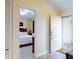 View of bedroom from hallway, showcasing bed and decor at 452 Bouchelle Dr # 303, New Smyrna Beach, FL 32169