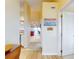 Hallway with beachy decor, leading to living room and other rooms at 452 Bouchelle Dr # 303, New Smyrna Beach, FL 32169