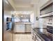 Kitchen with stainless steel appliances and granite countertops at 452 Bouchelle Dr # 303, New Smyrna Beach, FL 32169