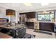 Modern kitchen with dark cabinetry, stainless steel appliances, and breakfast nook at 503 Boxwood Ln, New Smyrna Beach, FL 32168