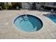 Relaxing circular hot tub with tiled surround at 5207 S Atlantic Ave # 0622, New Smyrna Beach, FL 32169
