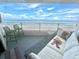 Stunning ocean view from a condo balcony, featuring comfortable seating and a relaxing atmosphere at 5207 S Atlantic Ave # 0622, New Smyrna Beach, FL 32169