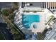 Inviting community pool with surrounding lounge chairs at 5207 S Atlantic Ave # 0622, New Smyrna Beach, FL 32169