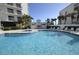 Inviting community pool with hot tub and lounge chairs at 5207 S Atlantic Ave # 0622, New Smyrna Beach, FL 32169