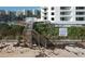 Wooden boardwalk and stairs providing convenient beach access at 5207 S Atlantic Ave # 0622, New Smyrna Beach, FL 32169