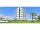 High-rise building with parking and landscaping at 5207 S Atlantic Ave # 0622, New Smyrna Beach, FL 32169