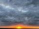 Stunning sunset over the water, scenic view at 5207 S Atlantic Ave # 0622, New Smyrna Beach, FL 32169