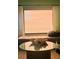 Window seat with ocean view and glass-top coffee table at 5207 S Atlantic Ave # 0622, New Smyrna Beach, FL 32169