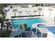 Relaxing community pool and spa with surrounding lounge chairs at 5207 S Atlantic Ave # 0622, New Smyrna Beach, FL 32169