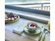Table setting with ocean view and pastries at 5207 S Atlantic Ave # 0622, New Smyrna Beach, FL 32169