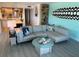Living room with sectional sofa, coffee table, and ocean view at 5207 S Atlantic Ave # 0622, New Smyrna Beach, FL 32169