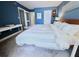 Spacious bedroom with a king-size bed and a work desk at 5207 S Atlantic Ave # 0622, New Smyrna Beach, FL 32169