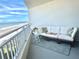Relaxing balcony with ocean view and comfortable seating at 5207 S Atlantic Ave # 0622, New Smyrna Beach, FL 32169