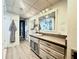 Modern bathroom with a large vanity and updated flooring at 5207 S Atlantic Ave # 0622, New Smyrna Beach, FL 32169