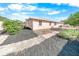 Landscaped backyard with walkway and mature shrubs at 110 Ponce Terrace Cir, Ponce Inlet, FL 32127