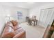 Home office with a leather couch and built-in desk at 110 Ponce Terrace Cir, Ponce Inlet, FL 32127