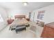 Bedroom with a queen bed and plenty of dresser space at 110 Ponce Terrace Cir, Ponce Inlet, FL 32127