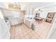 Open kitchen with breakfast bar and adjacent dining area at 110 Ponce Terrace Cir, Ponce Inlet, FL 32127