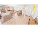 Bright living room featuring a fireplace and access to the front entrance at 110 Ponce Terrace Cir, Ponce Inlet, FL 32127