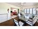 Bright sunroom with glass table and chairs, overlooking the living room at 120 Oakmont Ln, New Smyrna Beach, FL 32168