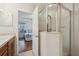 Bathroom with shower and view into bedroom at 2681 Sweet Magnolia Pl, Oviedo, FL 32765