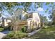 Two-story house with a paved driveway, landscaping, and a two-car garage at 2681 Sweet Magnolia Pl, Oviedo, FL 32765