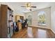 Bright home office featuring built-in shelving and hardwood floors at 2681 Sweet Magnolia Pl, Oviedo, FL 32765