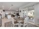 Bright dining area with a wooden table and chairs, near the kitchen at 2820 Neverland Dr, New Smyrna Beach, FL 32168