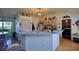Kitchen features light cabinets, a breakfast bar, and tile floors at 3218 Royal Palm Dr, Edgewater, FL 32141