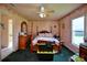 Main bedroom with a post bed and decorative walls at 3218 Royal Palm Dr, Edgewater, FL 32141