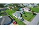 Single-story house with a spacious yard and a school bus parked in the driveway at 3218 Royal Palm Dr, Edgewater, FL 32141