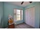Well-lit bedroom with double door closet and window at 3218 Royal Palm Dr, Edgewater, FL 32141
