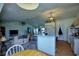Open floor plan with kitchen island, living area, and access to backyard at 3218 Royal Palm Dr, Edgewater, FL 32141