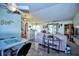Open living room with vaulted ceilings and access to the backyard at 3218 Royal Palm Dr, Edgewater, FL 32141