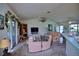 Bright living room with comfy seating and access to the patio at 3218 Royal Palm Dr, Edgewater, FL 32141