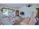 Spacious living room with comfortable seating and a large TV at 3218 Royal Palm Dr, Edgewater, FL 32141