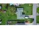Single-story house with a large backyard and a school bus parked nearby at 3218 Royal Palm Dr, Edgewater, FL 32141