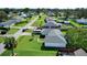 House with gray roof, surrounded by other houses and lush green yards at 3218 Royal Palm Dr, Edgewater, FL 32141