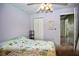 Spacious bedroom with ceiling fan and double closet at 3218 Royal Palm Dr, Edgewater, FL 32141
